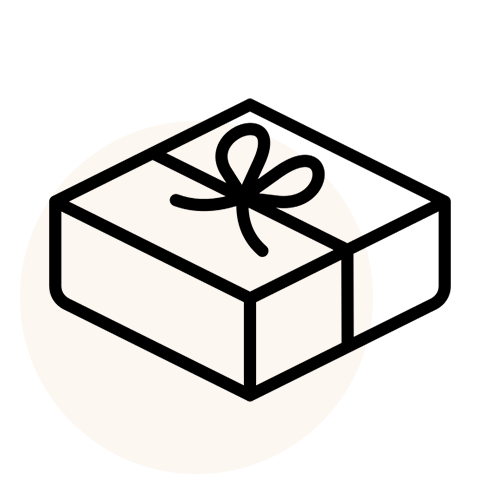 Gift box with a bow on a beige circle