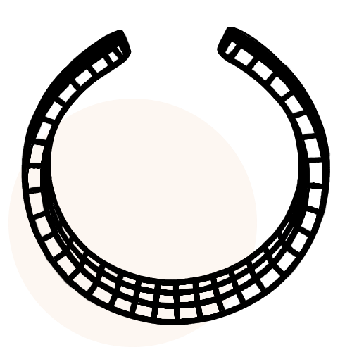 Black horseshoe on a beige circle with a green background